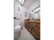 Bathroom with wood vanity, updated fixtures, and a shower/tub combo at 2935 Lichen Ln # C, Clearwater, FL 33760