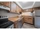 Kitchen boasts wood cabinets, stainless steel appliances, and ample counter space at 2935 Lichen Ln # C, Clearwater, FL 33760
