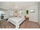 Spacious bedroom with a king-size bed, mirrored closet, and natural light at 2935 Lichen Ln # C, Clearwater, FL 33760