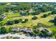 Aerial view of community with golf course and homes at 29129 S Bay Hollow S Dr # 3213, Wesley Chapel, FL 33543