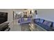 Bright living room with comfy sofas, a coffee table, and large windows at 29129 S Bay Hollow S Dr # 3213, Wesley Chapel, FL 33543