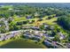 Aerial view of condo building near golf course and lake at 29129 S Bay Hollow S Dr # 3213, Wesley Chapel, FL 33543