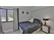 Cozy bedroom with a full-size bed and large window at 29129 S Bay Hollow S Dr # 3213, Wesley Chapel, FL 33543