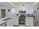 Well-equipped kitchen featuring stainless steel appliances and ample cabinet space at 29129 S Bay Hollow S Dr # 3213, Wesley Chapel, FL 33543