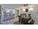Charming dining area with a table for six and access to the kitchen at 29129 S Bay Hollow S Dr # 3213, Wesley Chapel, FL 33543