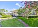 Two-story building with lush landscaping at 29129 S Bay Hollow S Dr # 3213, Wesley Chapel, FL 33543