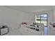 Living room with white sofas and golf course view at 29129 S Bay Hollow S Dr # 3213, Wesley Chapel, FL 33543