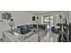 Spacious living room featuring comfortable seating and access to a patio at 29129 S Bay Hollow S Dr # 3213, Wesley Chapel, FL 33543