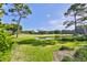 Landscaped golf course with pond and lush greenery at 29129 S Bay Hollow S Dr # 3213, Wesley Chapel, FL 33543