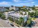 Charming city aerial shows a mix of buildings, trees, and vibrant city living at 201 6Th S St # 106, St Petersburg, FL 33701