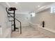 Large open room with tiled floor, decorative spiral staircase and bench seating at 201 6Th S St # 106, St Petersburg, FL 33701