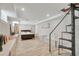 Bright, spacious bedroom with modern design, tile floor, bench seating and spiral stairs at 201 6Th S St # 106, St Petersburg, FL 33701