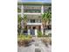 Exterior shot of apartments with lush landscaping and private entrances at 201 6Th S St # 106, St Petersburg, FL 33701