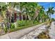 Apartment building exterior featuring lush landscaping and private entrances at 201 6Th S St # 106, St Petersburg, FL 33701
