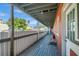 View from a covered deck with a wooden floor, overlooking a street at 201 6Th S St # 106, St Petersburg, FL 33701