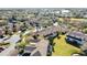 An aerial view of a neighborhood with many mature trees and ponds at 20308 Oak Key Ct, Tampa, FL 33647
