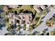 A birds-eye view showing the layout of the home and surrounding neighborhood with mature trees at 20308 Oak Key Ct, Tampa, FL 33647