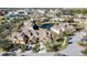 An aerial view of a neighborhood with ponds and mature trees at 20308 Oak Key Ct, Tampa, FL 33647