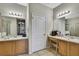 Bright bathroom featuring double sink vanity and neutral tiling at 20308 Oak Key Ct, Tampa, FL 33647