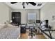 Bedroom featuring neutral paint, ceiling fan, and wood floors at 20308 Oak Key Ct, Tampa, FL 33647