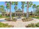 The community clubhouse features a welcoming entrance, beautiful landscaping, and a central water fountain at 20308 Oak Key Ct, Tampa, FL 33647