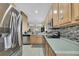 Modern kitchen features stainless steel appliances, sleek countertops, and ample storage; cooking made easy! at 20308 Oak Key Ct, Tampa, FL 33647