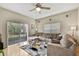 Spacious living room with a sliding glass door and stylish decor; perfect for relaxing and entertaining guests at 20308 Oak Key Ct, Tampa, FL 33647
