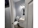 Clean bathroom with toilet, sink, and vanity at 7006 N 18Th St, Tampa, FL 33610