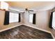 Spacious bedroom with dark wood flooring and ceiling fan at 7006 N 18Th St, Tampa, FL 33610