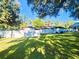 Large backyard with a privacy fence and lush lawn at 7006 N 18Th St, Tampa, FL 33610