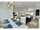 Open concept dining area with white table, and kitchen views at 1305 Apollo Beach Blvd, Apollo Beach, FL 33572