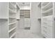 Large walk-in closet with ample shelving and drawers at 1305 Apollo Beach Blvd, Apollo Beach, FL 33572