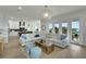 Bright living room with white sofas, a large TV, and water views at 1305 Apollo Beach Blvd, Apollo Beach, FL 33572