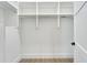 Bright white closet with shelves and hanging rods at 1305 Apollo Beach Blvd, Apollo Beach, FL 33572