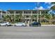 Three-story building with balconies and ample parking at 201 6Th S St # 106, St Petersburg, FL 33701