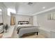 Spacious basement bedroom with built-in shelving and tile flooring at 201 6Th S St # 106, St Petersburg, FL 33701