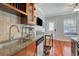 Modern kitchen with stainless steel appliances and granite countertops at 201 6Th S St # 106, St Petersburg, FL 33701
