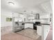 Modern kitchen with stainless steel appliances and white cabinets at 1438 Morrow Dr, Clearwater, FL 33756