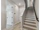 Modern staircase with light wood and white risers at 6605 N Nebraska Ave # 3, Tampa, FL 33604