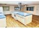 Modern kitchen with an island and stainless steel appliances at 9790 66Th N St # 196, Pinellas Park, FL 33782