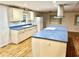 Updated kitchen featuring a large island and blue countertops at 9790 66Th N St # 196, Pinellas Park, FL 33782