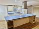 Modern kitchen with a large island and white cabinets at 9790 66Th N St # 196, Pinellas Park, FL 33782
