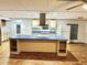 Kitchen with island, white cabinets, and stainless steel appliances at 9790 66Th N St # 196, Pinellas Park, FL 33782