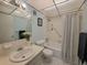 Clean bathroom with tub/shower combination, toilet, and vanity at 2001 Greenbriar Blvd # 5, Clearwater, FL 33763