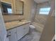 Clean bathroom with granite countertop and bathtub at 8616 N Mulberry St, Tampa, FL 33604