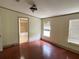 Main bedroom with hardwood floors and ensuite bathroom at 17889 Thomas Blvd, Hudson, FL 34667