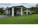 Home with covered carport and storage shed at 17889 Thomas Blvd, Hudson, FL 34667
