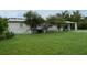 Single-story home with covered porch and large yard at 17889 Thomas Blvd, Hudson, FL 34667