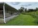 Long covered porch runs along the side of the house at 17889 Thomas Blvd, Hudson, FL 34667