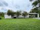 Single-story home with covered porch and large yard at 17889 Thomas Blvd, Hudson, FL 34667
